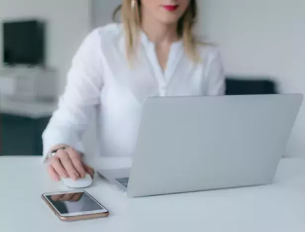 woman-using-silver-laptop-2265488